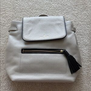 kate spade Light Gray Pebbled Leather Backpack with Black Tassel
